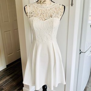 White lace open back mini dress size XS.